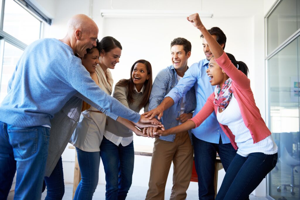 Diverse professionals highlighting team building strategies that drive motivation and success.